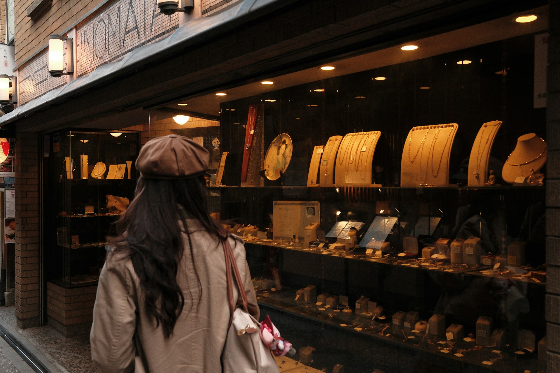 Shopper browsing racks in a retail store, discovering a local business
